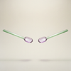 Two glass straws with pink oval tips on a beige background