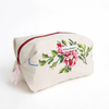 Handmade cream boxy zipper pouch with cross-stitch rose bouquet and pink ribbon pull, Montreal artisan Willow Branch / Pochette boxy crème zippée avec bouquet de roses brodées au point de croix et tirette rose, artisane montréalaise Willow Branch