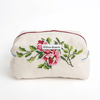 Embroidered pouch with floral design and 'Willow Branch' label on a white background