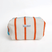 Rectangular pouch with orange stripes and 'Willow Branch' label on a white background