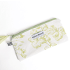 Handmade white flat zipper pouch with green toile floral print and tassel pull, Montreal artisan Willow Branch / Pochette plate zippée blanche à motif toile florale verte avec tirette pompons, artisane montréalaise Willow Branch