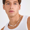 
Man wearing gold plated beaded necklace with sand-toned beads and starfish charms | Homme portant un collier perlé plaqué or avec perles sablées et breloques étoile de mer