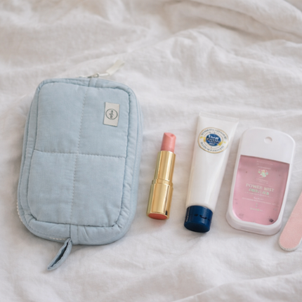 Trousse de toilette matelassée en coton gris nuage