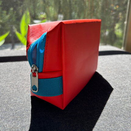 Trousse de maquillage orange et turquoise