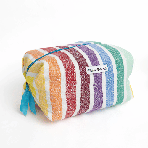 Colorful striped blanket with 'Willow Branch' label on a white background